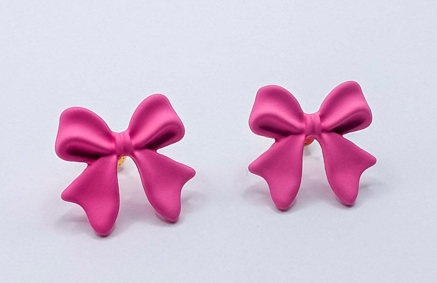 Belles boucles d'oreilles en forme de nœud rose