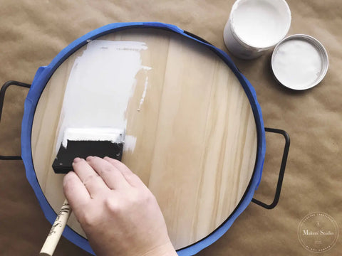 Hand painting round wooden tray with One Step Paint 16oz, highly pigmented white.