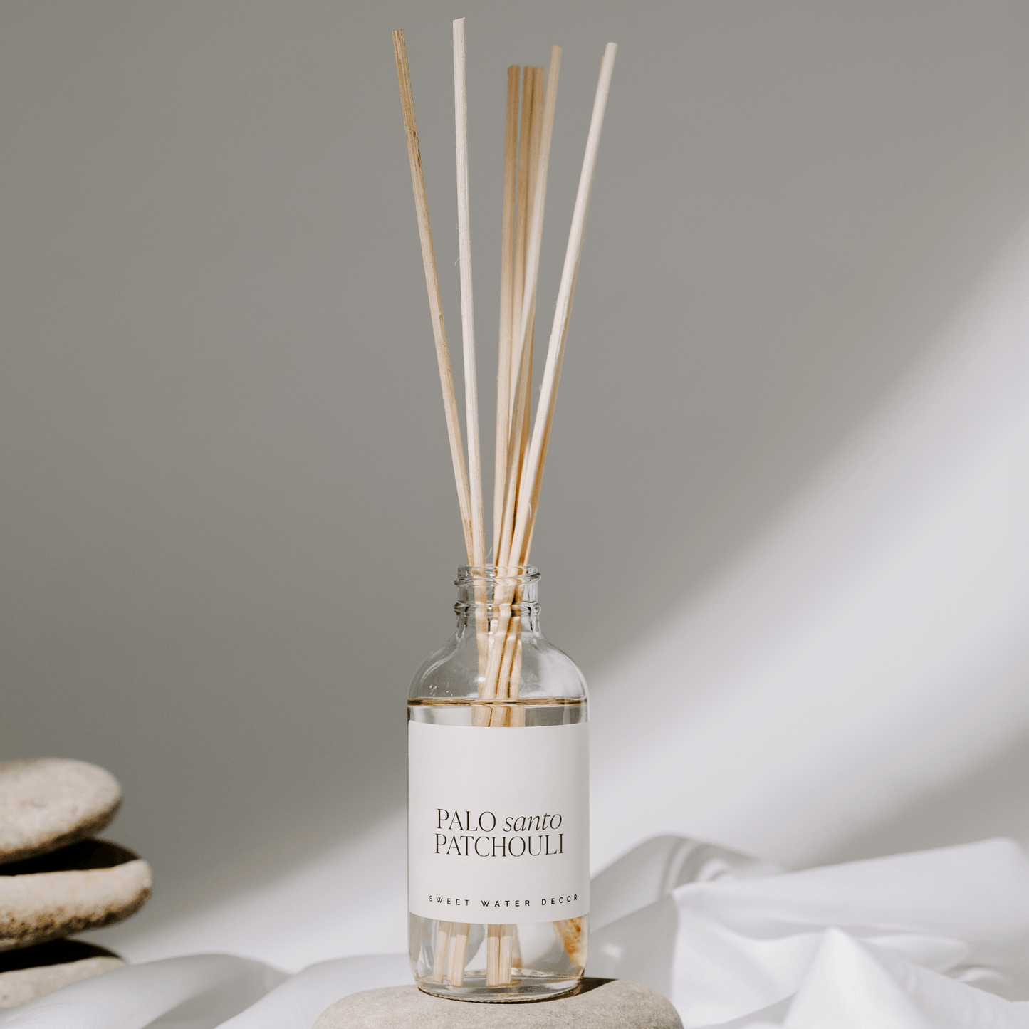 Diffuseur de roseaux transparents Palo Santo Patchouli