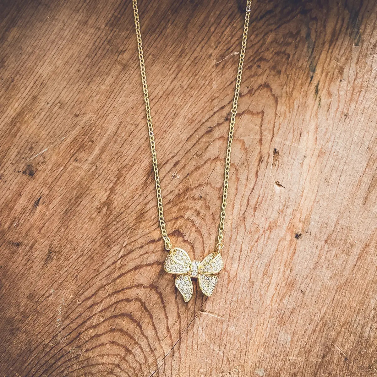 Gold Rhinestone Bow Necklace - Rooted Home Goods