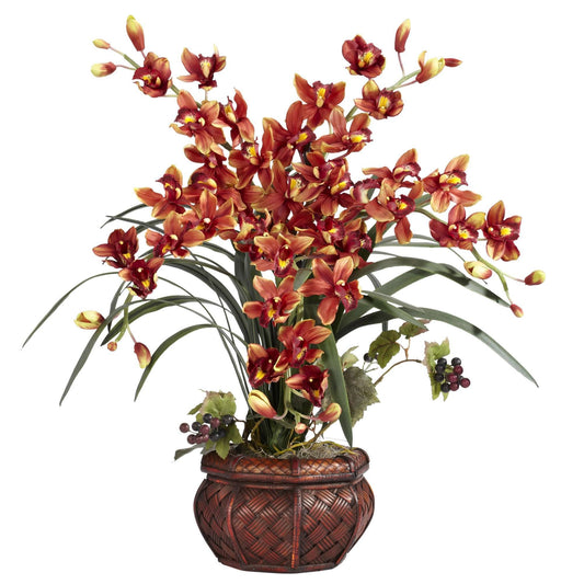 Cymbidium avec arrangement décoratif en soie dans un vase