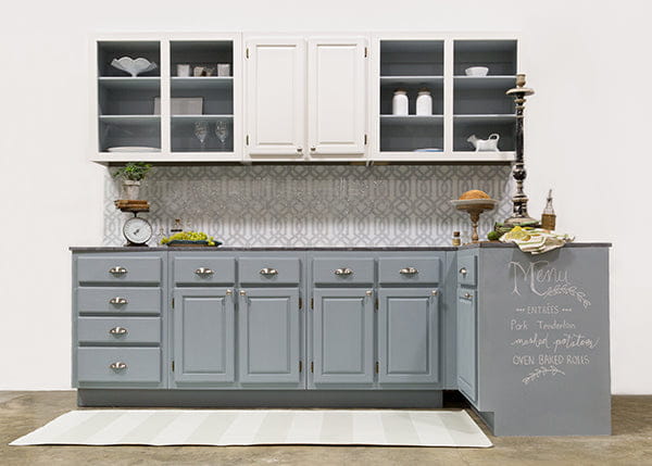 Gray kitchen cabinets with white uppers, silver hardware, light wax vintage sheen