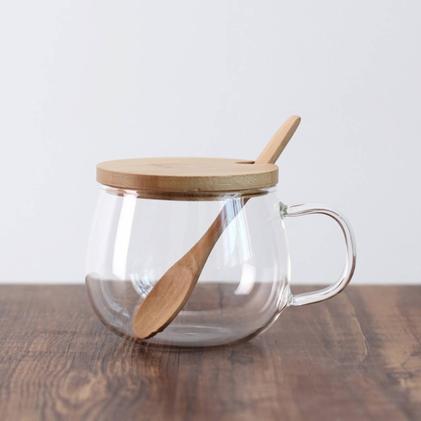 Taza de té de vidrio de borosilicato con tapa de bambú y cuchara