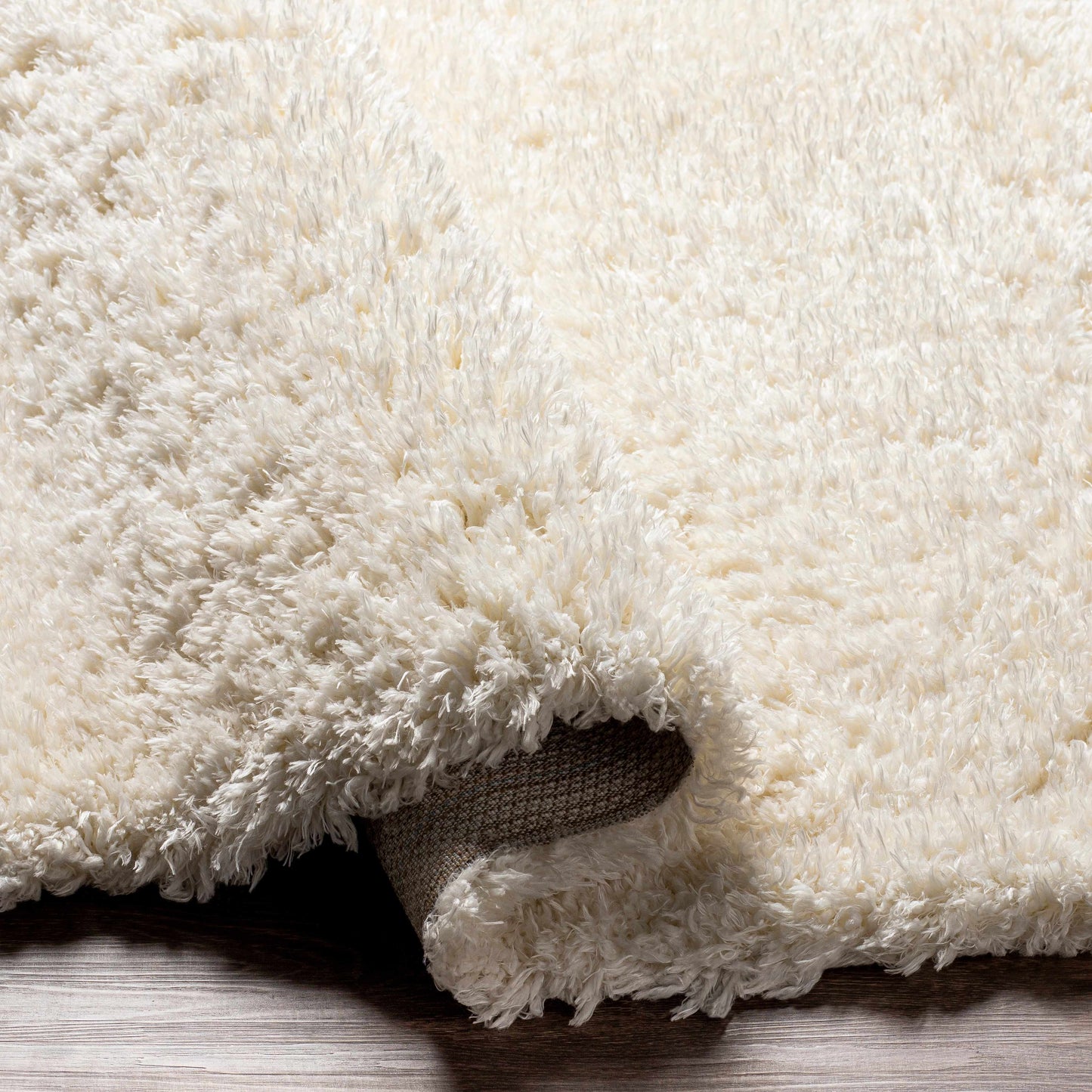 Tapis en peluche Siari couleur crème unie